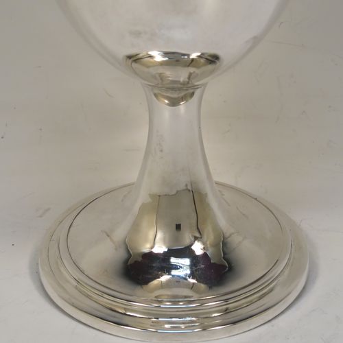A large and very handsome Antique Georgian Sterling Silver goblet, having a plain round tapering body, sitting on a pedestal foot with a reeded border. This elegant antique silver goblet was made by Robert Scott II of Newcastle in ca. 1800. The dimensions of this fine hand-made antique silver goblet are height 16 cms (6.3 inches), diameter at lip 9.5 cms (3.75 inches), and it weighs approx. 194g (6.3 troy ounces).
