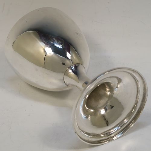 A large and very handsome Antique Georgian Sterling Silver goblet, having a plain round tapering body, sitting on a pedestal foot with a reeded border. This elegant antique silver goblet was made by Robert Scott II of Newcastle in ca. 1800. The dimensions of this fine hand-made antique silver goblet are height 16 cms (6.3 inches), diameter at lip 9.5 cms (3.75 inches), and it weighs approx. 194g (6.3 troy ounces).