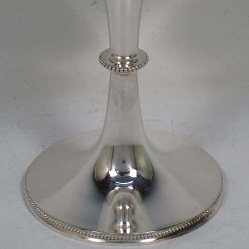 A handsome Antique Edwardian Sterling Silver goblet, having a plain round tapering body, and sitting on a pedestal foot with an applied bead-edged border, and a gold-gilt interior. Made by Henry Atkins of Sheffield in 1903. The dimensions of this fine hand-made antique silver goblet are height 17.5 cms (6.75 inches), diameter at lip 8 cms (3 inches), and it weighs approx. 147g (4.7 troy ounces).    
