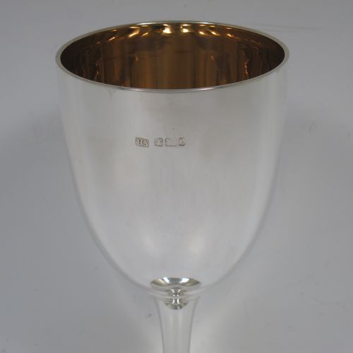 A handsome Antique Edwardian Sterling Silver goblet, having a plain round tapering body, and sitting on a pedestal foot with an applied bead-edged border, and a gold-gilt interior. Made by Henry Atkins of Sheffield in 1903. The dimensions of this fine hand-made antique silver goblet are height 17.5 cms (6.75 inches), diameter at lip 8 cms (3 inches), and it weighs approx. 147g (4.7 troy ounces).    