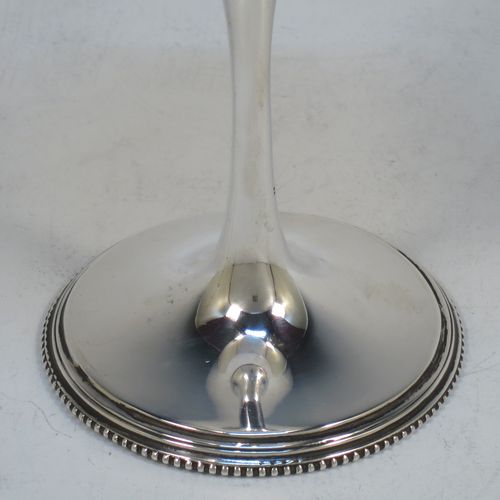 A handsome Antique Victorian Sterling Silver goblet, having a plain round tapering body, and sitting on a plain pedestal foot with an applied bead border. Made by Henry Wilkinson of Sheffield in 1900. The dimensions of this fine hand-made antique silver goblet are height 16.5 cms (6.5 inches), diameter at lip 8 cms (3.25 inches), and it weighs approx. 142g (4.6 troy ounces).