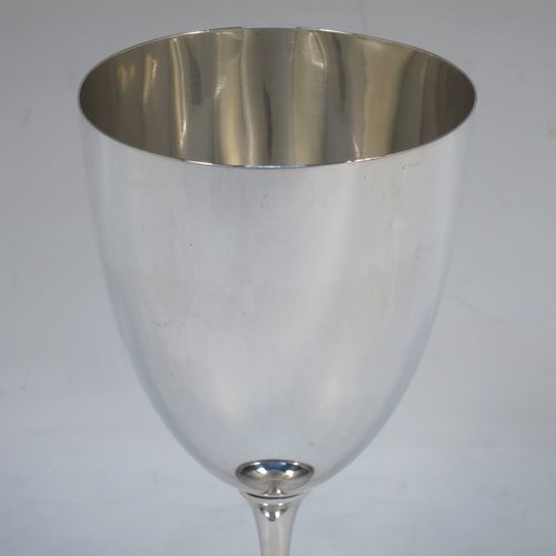 A handsome Antique Victorian Sterling Silver goblet, having a plain round tapering body, and sitting on a plain pedestal foot with an applied bead border. Made by Henry Wilkinson of Sheffield in 1900. The dimensions of this fine hand-made antique silver goblet are height 16.5 cms (6.5 inches), diameter at lip 8 cms (3.25 inches), and it weighs approx. 142g (4.6 troy ounces).