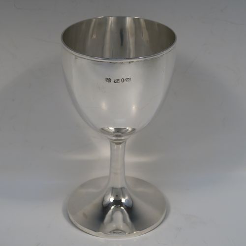 A very handsome Antique Georgian Sterling Silver goblet, having a very plain round tapering body, and sitting on a matching pedestal foot. This elegant silver wine goblet was made by Hawksworth Eyre and Co., of Sheffield in 1833. The dimensions of this fine hand-made antique silver goblet are height 17 cms (6.6 inches), diameter at lip 9 cms (3.5 inches), and it weighs approx. 258g (8.3 troy ounces).   