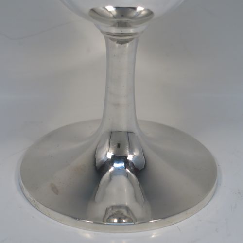 A very handsome Antique Georgian Sterling Silver goblet, having a very plain round tapering body, and sitting on a matching pedestal foot. This elegant silver wine goblet was made by Hawksworth Eyre and Co., of Sheffield in 1833. The dimensions of this fine hand-made antique silver goblet are height 17 cms (6.6 inches), diameter at lip 9 cms (3.5 inches), and it weighs approx. 258g (8.3 troy ounces).   