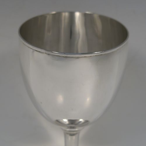 A very handsome Antique Georgian Sterling Silver goblet, having a very plain round tapering body, and sitting on a matching pedestal foot. This elegant silver wine goblet was made by Hawksworth Eyre and Co., of Sheffield in 1833. The dimensions of this fine hand-made antique silver goblet are height 17 cms (6.6 inches), diameter at lip 9 cms (3.5 inches), and it weighs approx. 258g (8.3 troy ounces).   
