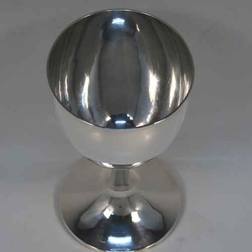 A very handsome Antique Georgian Sterling Silver goblet, having a very plain round tapering body, and sitting on a matching pedestal foot. This elegant silver wine goblet was made by Hawksworth Eyre and Co., of Sheffield in 1833. The dimensions of this fine hand-made antique silver goblet are height 17 cms (6.6 inches), diameter at lip 9 cms (3.5 inches), and it weighs approx. 258g (8.3 troy ounces).   