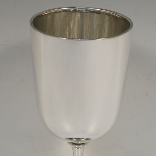 A very handsome Antique Sterling Silver large goblet, having a plain round tapering body, and sitting on a plain pedestal foot with an applied bead border. This beautiful antique silver goblet was made by Jackson and Fullerton of London in 1913. The dimensions of this fine hand-made antique silver goblet are height 18.5 cms (7.3 inches), diameter at lip 8 cms (3.25 inches), and it weighs approx. 189g (6 troy ounces).