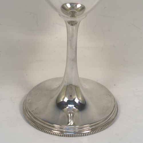 An elegant Antique Victorian Sterling Silver wine goblet, having a plain round body, a gold-gilt interior, and all sitting on a pedestal foot with an applied bead-edged border. This handsome antique silver wine goblet was made by Henry Wilkinson of Sheffield in 1898. The dimensions of this fine hand-made silver goblet are height 19 cms (7.5 inches), diameter of body at lip 9 cms (3.5 inches), and it weighs approx.202g (6.5 troy ounces).