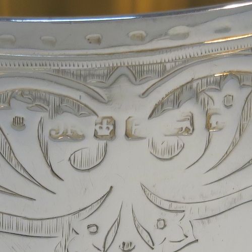 A very pretty Antique Victorian Sterling Silver goblet, having a round body with tapering sides and hand-engraved floral and scroll decoration, a gold-gilt interior, and sitting on a pedestal foot with hand-engraved decoration and an applied bead-edged border. This beautiful silver goblet was made by Joseph Rogers of Sheffield in 1875. The dimensions of this fine hand-made antique silver goblet are height 17 cms (6.6 inches), diameter at lip 9 cms (3.5 inches), and it weighs approx. 211g (6.8 troy ounces).  