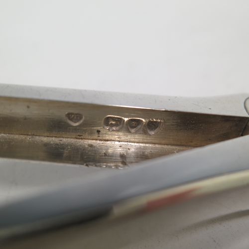 A very pretty Antique Victorian Sterling Silver pair of grape shears or scissors in the double struck Kings pattern with reeded handles. Made by Francis Higgins of London in 1893. The dimensions of this fine hand-made pair of antique silver grape scissors or shears are length 18 cms (7 inches), and they weigh approx. 124g (4 troy ounces).