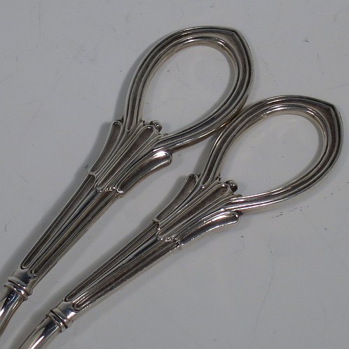A Sterling Silver pair of grape shears or scissors in the double-struck Albany pattern. Made by George Howson of Sheffield in 1928. The dimensions of this fine hand-made pair of silver grape scissors or shears are length 19 cms (7.5 inches), and they weigh approx. 124g (4 troy ounces).    