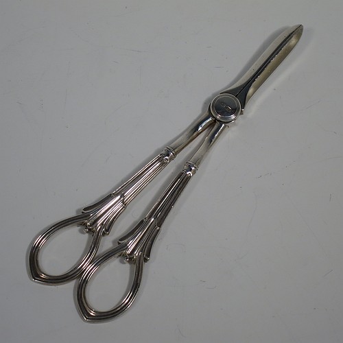 A Sterling Silver pair of grape shears or scissors in the double-struck Albany pattern. Made by George Howson of Sheffield in 1928. The dimensions of this fine hand-made pair of silver grape scissors or shears are length 19 cms (7.5 inches), and they weigh approx. 124g (4 troy ounces).    