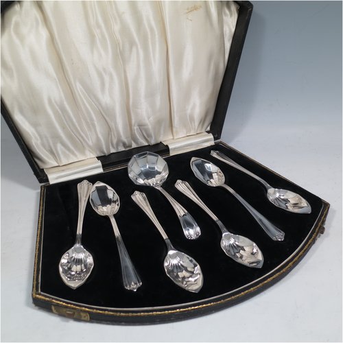 A Sterling Silver Art Deco set of six grape-fruit spoons and a sugar ladle, having panelled pointed oval bowls, and reeded Art Deco Belmont pattern handles, all in original white satin and black velvet-lined presentation box. Made by Marson & Jones of Birmingham in 1931. The dimensions of these fine hand-made grapefruit spoons are length 15 cms (6 inches), and they weigh a total of 248g (8 troy ounces).    