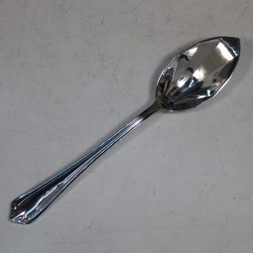 A Sterling Silver Art Deco set of six grape-fruit spoons and a sugar ladle, having panelled pointed oval bowls, and reeded Art Deco Belmont pattern handles, all in original white satin and black velvet-lined presentation box. Made by Marson & Jones of Birmingham in 1931. The dimensions of these fine hand-made grapefruit spoons are length 15 cms (6 inches), and they weigh a total of 248g (8 troy ounces).    