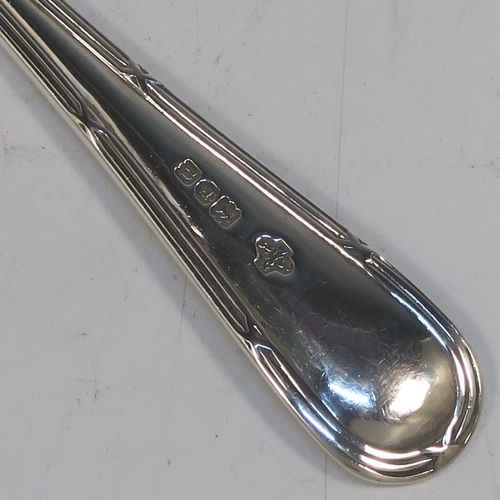 A large and very elegant set of Antique Edwardian Sterling Silver grape-fruit spoons, in the double-struck Reed and Ribbon pattern, having plain pointed oval bowls, and all in their original white satin and maroon velvet-lined presentation box. These beautiful antique silver grape-fruit spoons were made by William Hutton and Sons of London in 1908. The dimensions of these fine hand-made silver grapefruit spoons are length 15 cms (6 inches), and they weigh a total of 181g (5.8 troy ounces).
