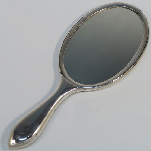 A beautiful Antique Victorian Indian Sterling Silver hand-mirror, having an oval body with a hand-chased scene of animals including lions, deer, dogs, leopards, and elephants, surrounding a central vacant round cartouche, and an oval mounted mirror in a plain frame. This fantastic silver hand mirror was probably made for the Indian market in ca. 1880. The dimensions of this fine hand-made silver hand mirror are length 28 cms (11 inches), and width of main body 11 cms (4.3 inches).