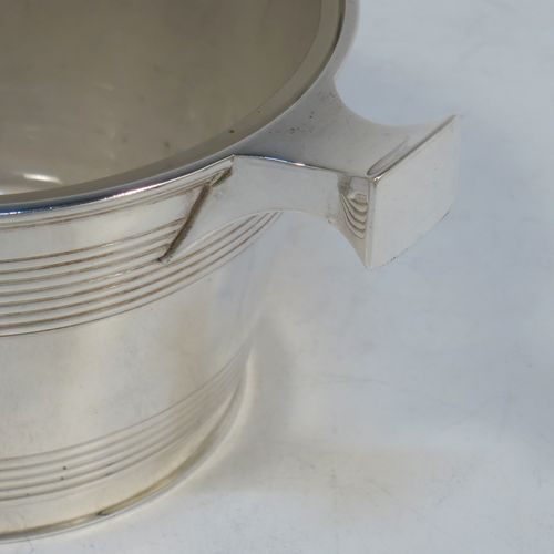 A very handsome Antique Victorian Sterling Silver and crystal honey, jam, or conserve jar, in the shape of a Quaich, having a plain round body with tapering sides and reeded decoration, two side handles, and with a frosted cut crystal insert with a star-cut base. Made by Martin Hall and Co., of Sheffield in 1896. The dimensions of this fine hand-made silver and crystal Quaich style conserve, jam, or honey jar are height 6 cms (5.5 inches), diameter 10 cms (4 inches), and it weighs approx. 235g (7.6 troy ounces).