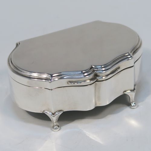A very handsome Antique Sterling Silver jewelery box, having a dressing table style plain rectangular bow-fronted body, a plain flat topped hinged lid with a reeded border, a gold gilt and maroon velvet-lined interior, and all sitting on four cabriolet feet. This elegant antique silver jewellery box was made by A. and J. Zimmerman of Birmingham in 1914. The dimensions of this fine hand-made antique silver jewellery box are width 9 cms (3.5 inches), depth 6.5 cms (2.5 inches), and height 4 cms (1.5 inches)   
