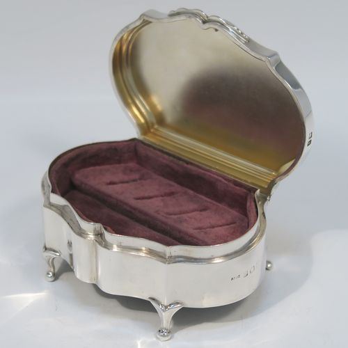 A very handsome Antique Sterling Silver jewelery box, having a dressing table style plain rectangular bow-fronted body, a plain flat topped hinged lid with a reeded border, a gold gilt and maroon velvet-lined interior, and all sitting on four cabriolet feet. This elegant antique silver jewellery box was made by A. and J. Zimmerman of Birmingham in 1914. The dimensions of this fine hand-made antique silver jewellery box are width 9 cms (3.5 inches), depth 6.5 cms (2.5 inches), and height 4 cms (1.5 inches)