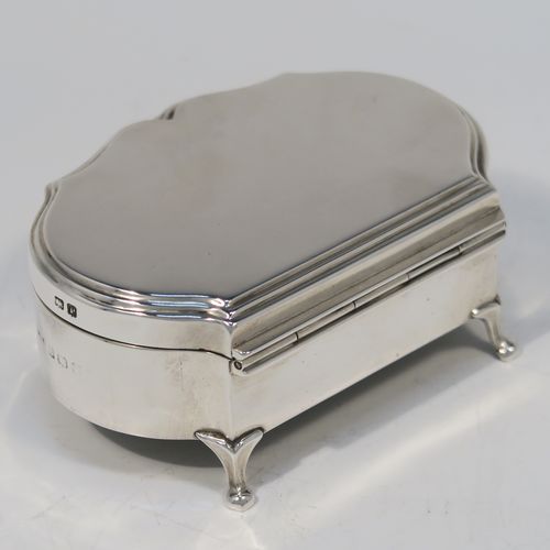 A very handsome Antique Sterling Silver jewelery box, having a dressing table style plain rectangular bow-fronted body, a plain flat topped hinged lid with a reeded border, a gold gilt and maroon velvet-lined interior, and all sitting on four cabriolet feet. This elegant antique silver jewellery box was made by A. and J. Zimmerman of Birmingham in 1914. The dimensions of this fine hand-made antique silver jewellery box are width 9 cms (3.5 inches), depth 6.5 cms (2.5 inches), and height 4 cms (1.5 inches)