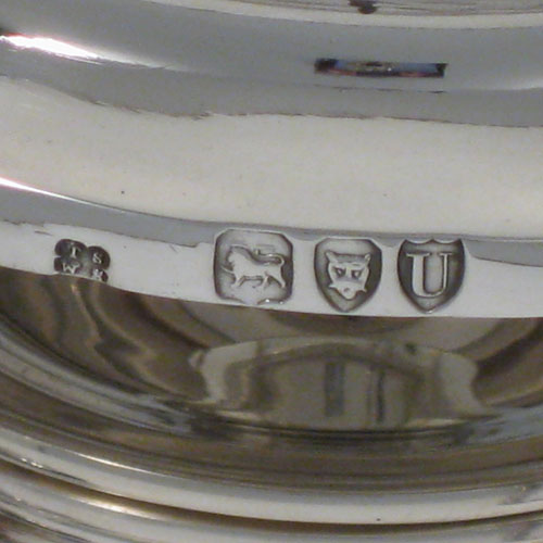Antique Victorian sterling silver kettle on a burner stand in an early George I style, having a very plain round body, with wooden insulated scroll handle, a plain spout, a hinged lid with invisible hinge and wooden finial, and all sitting on a frame with original burner and securing pins with chains. All made by Thomas and Walter Slater of London in 1895. The dimensions of this fine hand-made silver kettle are height 32 cms (12.5 inches), length 21 cms (8.25 inches), and it weighs approx. 1,178g (38 troy ounces).