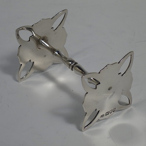 A very handsome pair of Antique Edwardian Sterling Silver knife rests, with cut square-shaped and hand-pierced rest ends, and round baluster central struts. Made by Charles Edwards of London in 1906. The dimensions of this fine hand-made pair of antique silver knife rests are length 7 cms (2.75 inches), height 4 cms (1.5 inches), and they weigh a total of approx. 92g (3 troy ounces).