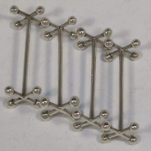 A very elegant Antique Georgian Sterling Silver set of four knife rests, with traditional cast Jack-style rest ends, and plain round central struts. These handsome antique silver knife rests were made by Charles Fox I of London in 1820. The dimensions of this fine hand-made set of antique silver knife rests are length 7.5 cms (3 inches), height 3 cms (1.25 inches), and they weigh a total of approx. 112g (3.6 troy ounces).
