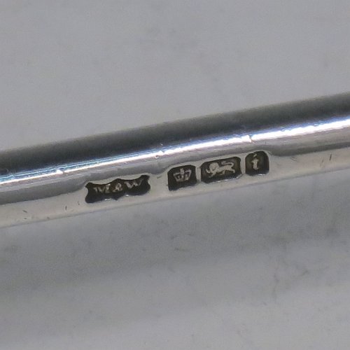 A Sterling Silver Art Deco pair of knife rests, with very plain geometric rest ends, and plain central struts. Made by Mappin & Webb of Sheffield in 1926. The dimensions of this fine hand-made pair of silver knife rests are length 9 cms (3.5 inches), height 3 cms (1.3 inches), and they weigh a total of approx. 128g (4 troy ounces).
