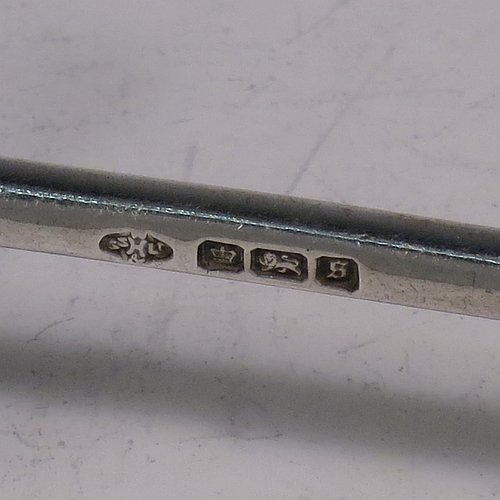 An Antique Edwardian Sterling Silver pair of knife rests, with traditional cast Jack-style rest ends, and plain round central struts. Made by William Hutton & Sons of Sheffield in 1910. The dimensions of this fine hand-made pair of antique silver knife rests are length 8 cms (3 inches), height 3 cms (1.25 inches), and they weigh a total of approx. 101g (3.3 troy ounces).