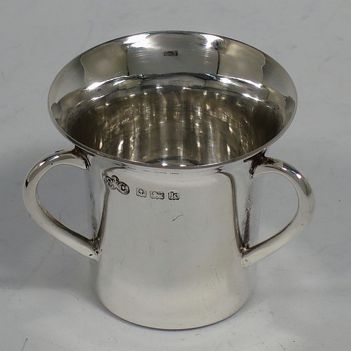 An Antique Edwardian Sterling Silver set of six liqueor tots or measures, round straight-sided bodies with three loop side-handles, all in their original cream satin and dark blue velvet-lined presentation box. Made by Elkington and Co., of Birmingham in 1909. The dimensions of this fine hand-made antique silver liqueur set are height 4 cms (1.5 inches), diameter 4 cms (1.5 inches), and the total weight is approx. 195g (6.3 troy ounces).