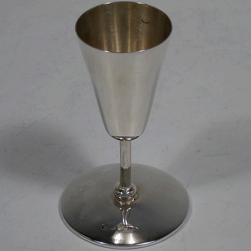 A handsome Antique Edwardian Sterling Silver set of six liqueor tots or measures, having very plain round bodies with tapering sides, sitting on round pedestal feet, and all fitted in their original satin and blue velvet-lined presentation box. Made by Walker and Hall of Birmingham in 1908. The dimensions of this fine hand-made antique silver liqueur tots are height 7.5 cms (3 inches), diameter at base 4.5 cms (1.75 inches), and the total weight is approx. 143g (4.6 troy ounces).