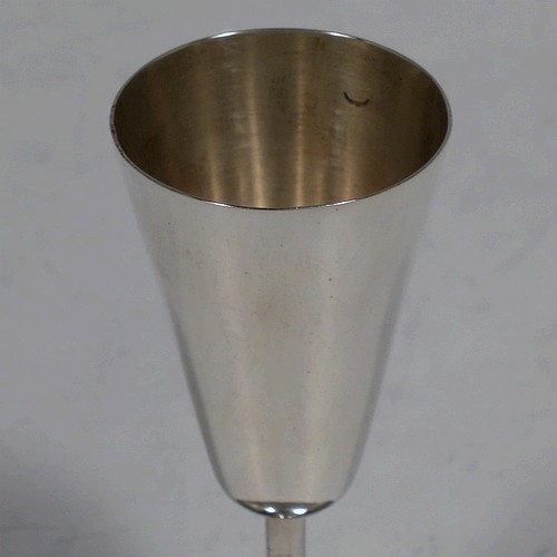 A handsome Antique Edwardian Sterling Silver set of six liqueor tots or measures, having very plain round bodies with tapering sides, sitting on round pedestal feet, and all fitted in their original satin and blue velvet-lined presentation box. Made by Walker and Hall of Birmingham in 1908. The dimensions of this fine hand-made antique silver liqueur tots are height 7.5 cms (3 inches), diameter at base 4.5 cms (1.75 inches), and the total weight is approx. 143g (4.6 troy ounces).
