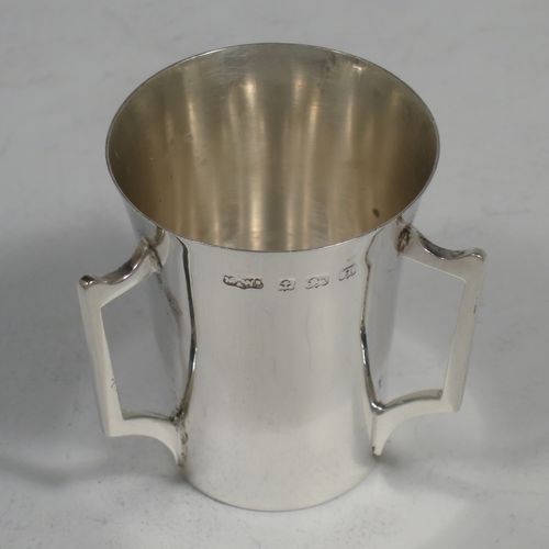 A handosme Antique Sterling Silver set of six liqueor tots or measures, having plain round bodies with tapering sides, three side-handles, and sitting on flat bases. Made by Mappin and Webb of Birmingham in 1915. The dimensions of this fine hand-made antique silver liqueur tot set are height 4 cms (1.5 inches), diameter at lip 4 cms (1.5 inches), and their total weight is approx. 165g (5.3 troy ounces).    