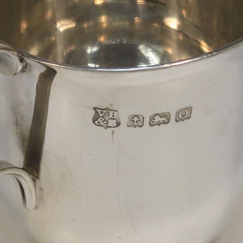 A handsome Antique Sterling Silver set of six liqueor tots or measures in a porringer style, having plain round bodies with tapering sides, two reeded side-handles, and sitting on flat bases. This elegant set of liqueur measures were made by Vale Brothers and Sermon of Birmingham in 1913. The dimensions of this fine hand-made antique silver liqueur tot set are height 4.5 cms (1.75 inches), diameter at lip 4 cms (1.5 inches), and their total weight is approx. 159g (5 troy ounces).