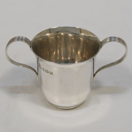 A handsome Antique Sterling Silver set of six liqueor tots or measures in a porringer style, having plain round bodies with tapering sides, two reeded side-handles, and sitting on flat bases. This elegant set of liqueur measures were made by Vale Brothers and Sermon of Birmingham in 1913. The dimensions of this fine hand-made antique silver liqueur tot set are height 4.5 cms (1.75 inches), diameter at lip 4 cms (1.5 inches), and their total weight is approx. 159g (5 troy ounces).