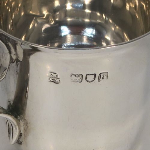 A handsome Antique Edwardian Sterling Silver set of six liqueor tots or measures in a porringer style, having plain round bodies with tapering sides, two reeded side-handles, and sitting on flat bases, all in their original cream satin and dark blue velvet presentation box. This elegant set of liqueur measures were made by Wakely and Wheeler of London in 1903. The dimensions of this fine hand-made antique silver liqueur tot set are height 4 cms (1.5 inches), diameter at lip 4 cms (1.5 inches), and their total weight is approx. 189g (6 troy ounces).   