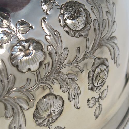 A beautiful Antique Victorian Silver Plated meat cover dome, having an oval domed body with hand-chased floral decoration surrounding two vacant cartouches on both sides, a cast floral loop handle, and an applied bead-edged bottom border. This stunning silver-plated meat cover was made in ca. 1870. The dimensions of this fine hand-made antique silver-plated meat cover dome are length 47 cm (18.5 inches), width 35.5 cms (14 inches), and height 28 cms (11 inches).   