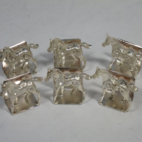 A very handsome Sterling Silver set of six place card holders, each one with a cast model of a horse foal, and all in their original white satin and dark-blue velvet-lined presentation box. Made by J. B. Chatterley and Sons Ltd., of Birmingham in 1994. The dimensions of this fine hand-made set of silver place card holders are length 3 cms (1.25 inches), height 3 cms (1.25 inches), and they weigh a total of approx. 106g (3.4 troy ounces).