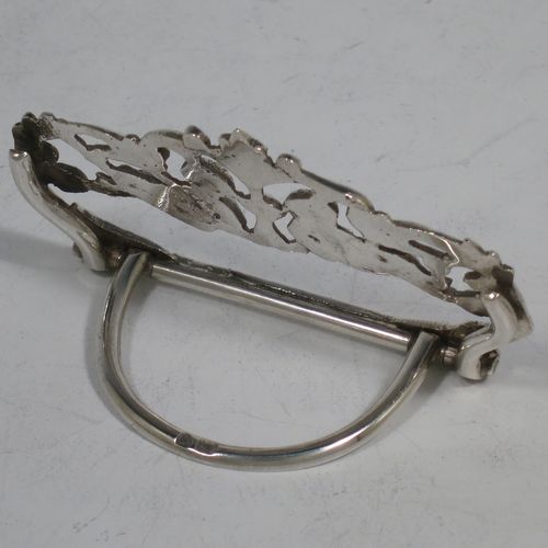 A very pretty Antique Victorian Sterling Silver set of four place card holders, having cast bodies with reclining cherubs over scroll and floral decoration, and sitting on half-circle wire-work bases. Made by Samuel Jacob of London in 1894. The dimensions of this fine set of antique silver place card holders are width 7 cms (2.75 inches), height 4 cms (1.5 inches), depth 3 cms (1.25 inches), and they weigh a total of approx. 106g (3.4 troy ounces).