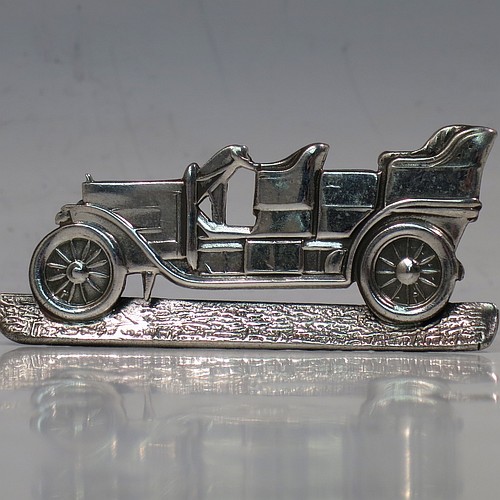 A very rare Antique Edwardian Sterling Silver set of twelve place card or menu card holders, having bodies in the shape of vintage motor cars, each mounted on a base with a semi-circular wire foot and slots for menus or place-cards. Made in Birmingham in 1907. The dimensions of this fine set of antique silver menu or place card holders are length 6.5 cms (2.5 inches), height 3 cms (1.2 inches), depth 3cms (1.2 inches), and they weigh a total of approx. 221g (7 troy ounces).