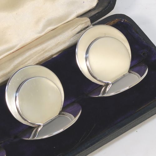 A very handsome and heavy Antique Sterling Silver set of four place card holders, having very plain round bodies, and all in their original white satin and dark-blue velvet-lined presentation box. These beautiful silver place card holders were made by Sampson and Morden of Chester in 1922. The dimensions of this fine hand-made set of antique silver place card holders are diameter of bases 4 cms (1.5 inches), height 4 cms (1.5 inches), and they weigh a total of approx. 149g (4.8 troy ounces).