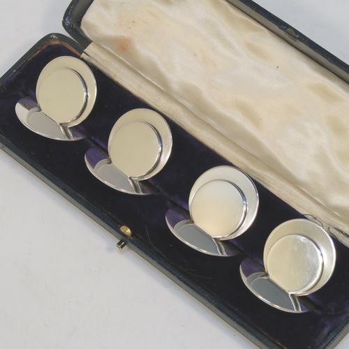 A very handsome and heavy Antique Sterling Silver set of four place card holders, having very plain round bodies, and all in their original white satin and dark-blue velvet-lined presentation box. These beautiful silver place card holders were made by Sampson and Morden of Chester in 1922. The dimensions of this fine hand-made set of antique silver place card holders are diameter of bases 4 cms (1.5 inches), height 4 cms (1.5 inches), and they weigh a total of approx. 149g (4.8 troy ounces).