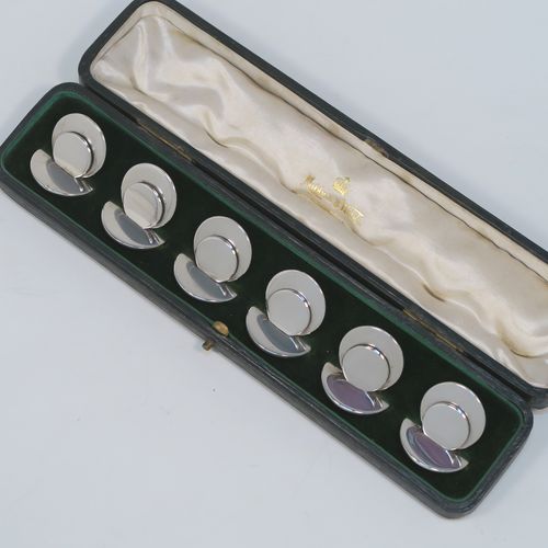 A very handsome and heavy Antique Sterling Silver set of six place card holders, having very plain round bodies, and all in their original white satin and dark-green velvet-lined presentation box. These beautiful silver place card holders were made by Sampson and Morden of Chester in 1911. The dimensions of this fine hand-made set of antique silver place card holders are diameter of bases 3 cms (1.25 inches), height 3 cms (1.25 inches), and they weigh a total of approx. 162g (5.2 troy ounces).