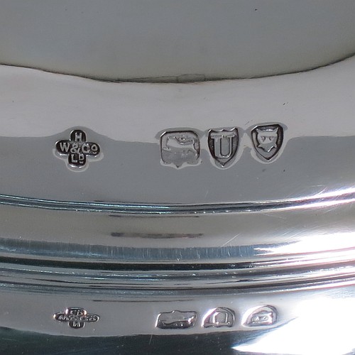 An Antique Victorian Sterling Silver covered muffin dish, having a plain domed lift-off lid with a round reeded handle, sitting on a plain round deep dish with a flat base. Made by William Hutton and Sons of London in 1895. The dimensions of this fine hand-made antique silver muffin dish are height 15 cms (6 inches), diameter of base dish 23 cms (9 inches), and with a total weight of approx. 788g (25 troy ounces).