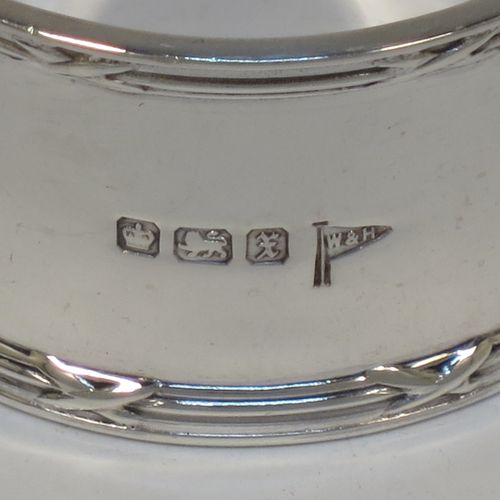 A very handsome Antique Sterling Silver set of six napkin rings, having plain round bodies with straight sides, with applied ribbon and reed borders, all in their original light blue satin and dark-blue velvet-lined presentation box. Made by Walker and Hall of Sheffield in 1915. The dimensions of these fine hand-made antique silver napkin rings are diameter 5 cms (2 inches), height 2.5 cms (1 inch), and they weigh a total of approx. 232g (7.5 troy ounces).