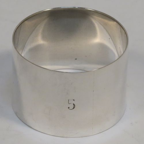A very handsome Antique Sterling Silver set of six napkin rings, having plain round bodies with straight sides, all in their original cream satin and black velvet-lined presentation box. This elegant set of antique silver napkin rings were made by Walker and Hall of Sheffield in 1915. The dimensions of these fine hand-made antique silver napkin rings are diameter 4 cms (1.5 inches), height 2.5 cms (1 inch), and they weigh a total of approx. 126g (4 troy ounces). Please note that these items are numbered 1 to 6.