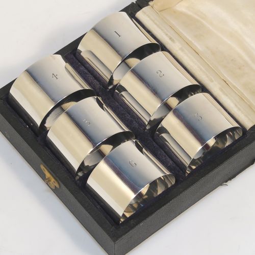 A very handsome Antique Sterling Silver set of six napkin rings, having plain round bodies with straight sides, all in their original cream satin and black velvet-lined presentation box. This elegant set of antique silver napkin rings were made by Walker and Hall of Sheffield in 1915. The dimensions of these fine hand-made antique silver napkin rings are diameter 4 cms (1.5 inches), height 2.5 cms (1 inch), and they weigh a total of approx. 126g (4 troy ounces). Please note that these items are numbered 1 to 6.