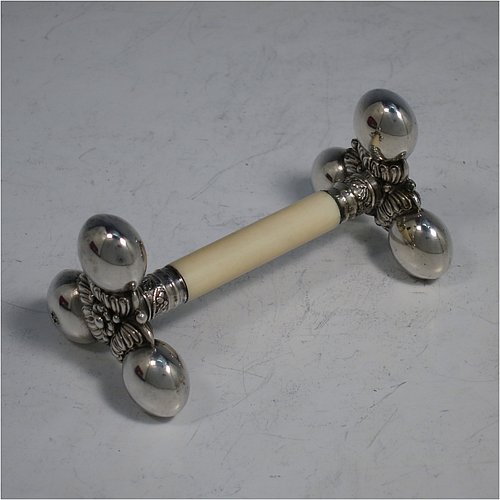 An Antique Victorian Silver-Plated and bone set of four napkin rings and two knife rests, the napkin rings having round straight-sided bodies with applied bands of floral decoration, the knife rests having cast floral supports with button ends, all in their original maroon satin and velvet-lined presentation box. Made by Elkington & Co., in ca. 1880. The dimensions of these fine hand-made antique silver plated and bone napkin rings are diameter 4.5 cms (1.75 inches), height 3 cms (1.25 inch), and the knife rests are 8.5 cms (3.3 inches) long by 4 cms (1.5 inches) high.