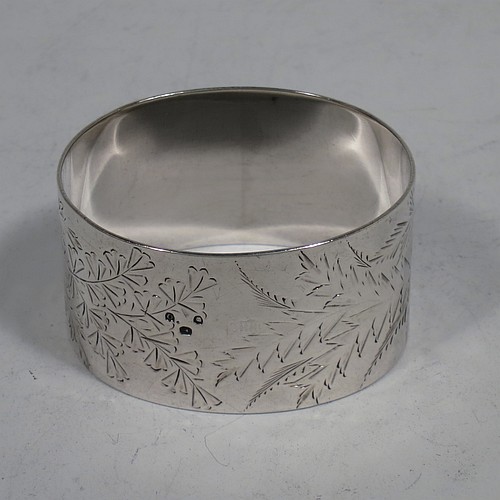A very pretty Antique Victorian Sterling Silver set of six napkin rings, having oval-shaped bodies with straight sides and hand-engraved ferns and gingko leaves surrounding a cartouche on one side, all in their original maroon satin and velvet-lined presentation box. Made by Edward Hutton of London in 1891. The dimensions of these fine hand-made antique silver napkin rings are length 5 cms (2 inches), height 3 cms (1.25 inch), and they weigh a total of approx. 166g (5 troy ounces). Please note that these items are crested and numbered 1 to 6.   