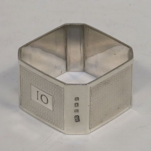 A very handsome and rare set of twelve Art Deco Sterling Silver napkin rings, having square bodies with chamfered corners and engine-turned engraving, all in their original cream and dark blue satin presentation box. This beautiful set of twelve silver napkin rings were made by Richard Richardson (poss.) of Birmingham in 1935. The dimensions of these fine hand-made and heavy Art Deco silver napkin rings are length 5 cms (2 inches) square, and they weigh a total of approx. 508g (16.4 troy ounces). Please note that these items are numbered 1 to 12.